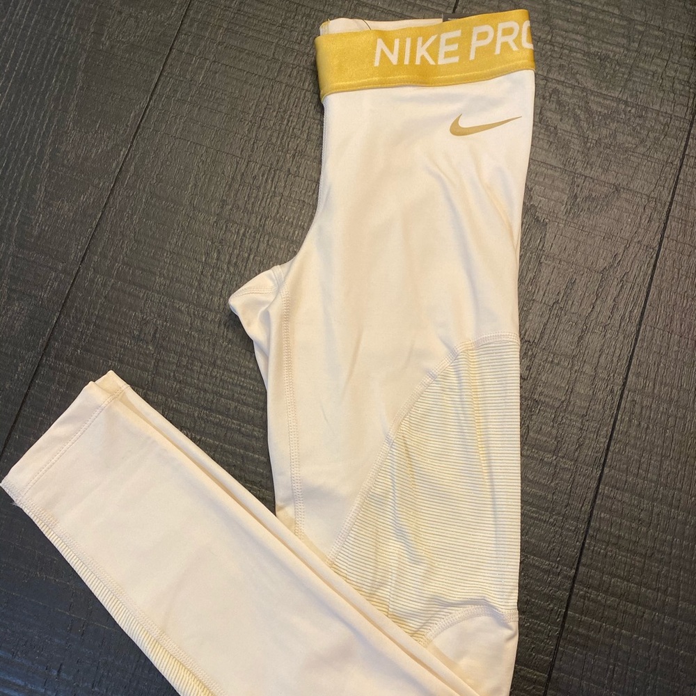 GOLD NIKE PRO TIGHT FIT LEGGINGS